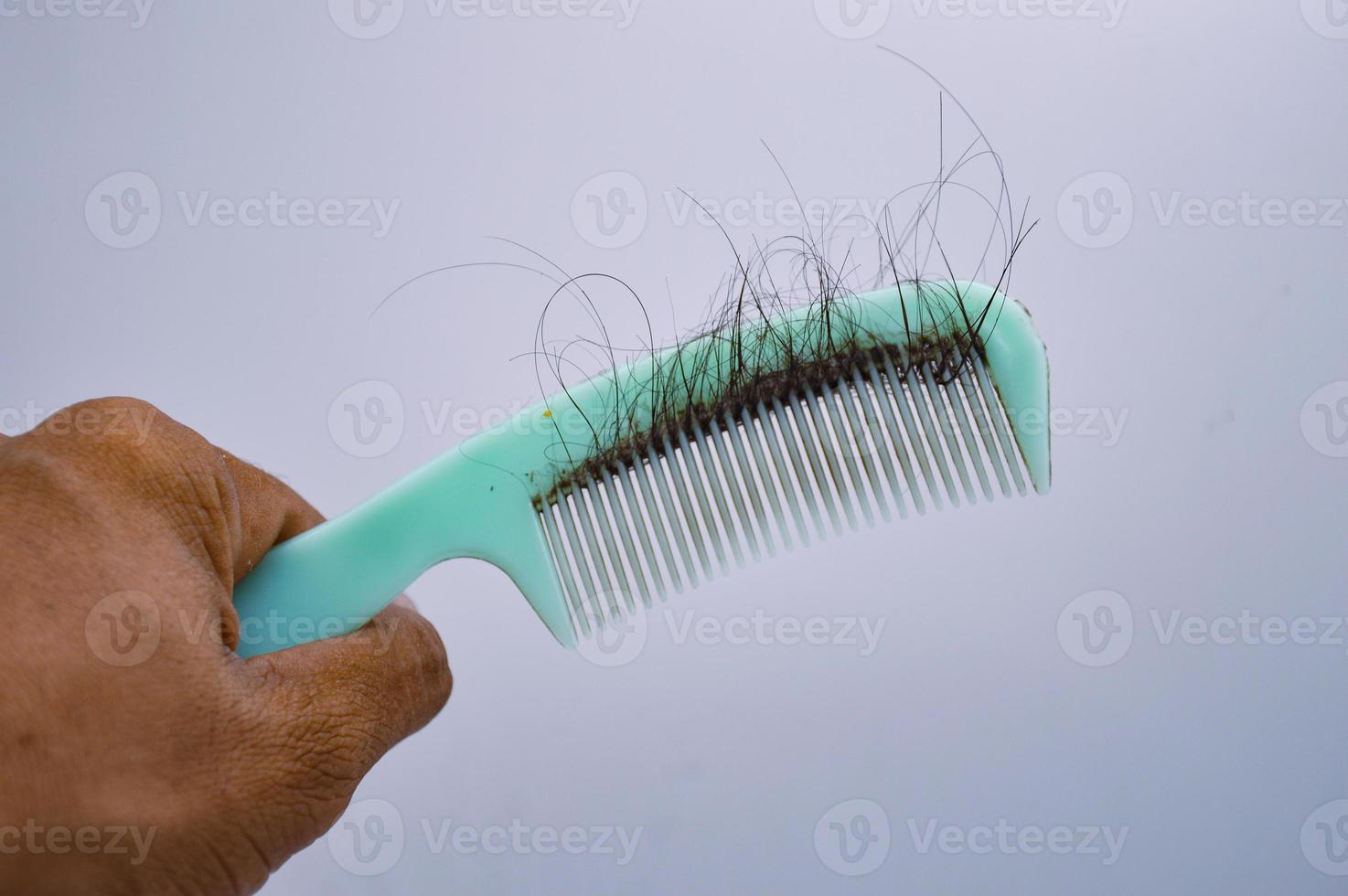 green comb handle  black hair falling  Hair care concept, cancer, chemotherapy, shampoo and conditioner advertisement photo