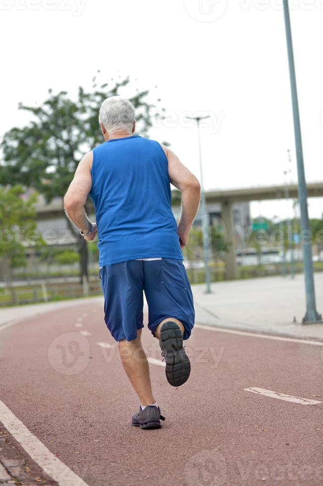 Senior runner on street photo