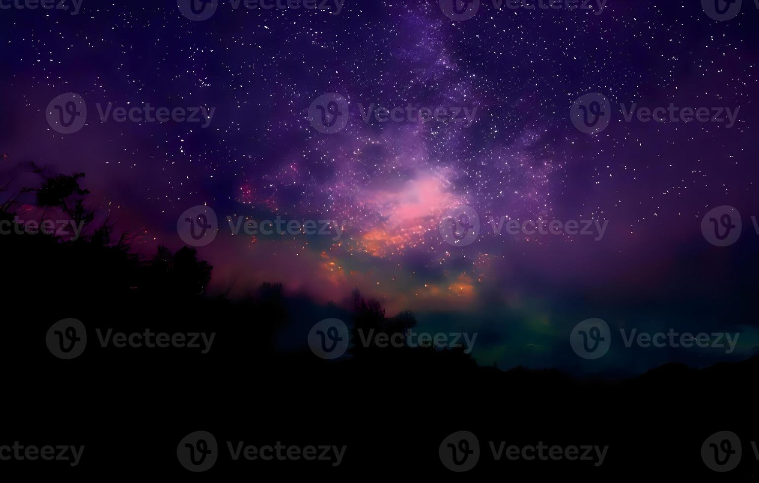 Milky Way and pink light at mountains. Night colorful landscape. Starry sky with hills at summer. Beautiful Universe. Space background with galaxy. Travel background photo