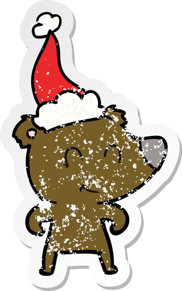 female bear distressed sticker cartoon of a wearing santa hat vector