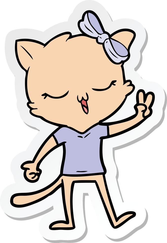 sticker of a cartoon cat with bow on head giving peace sign vector