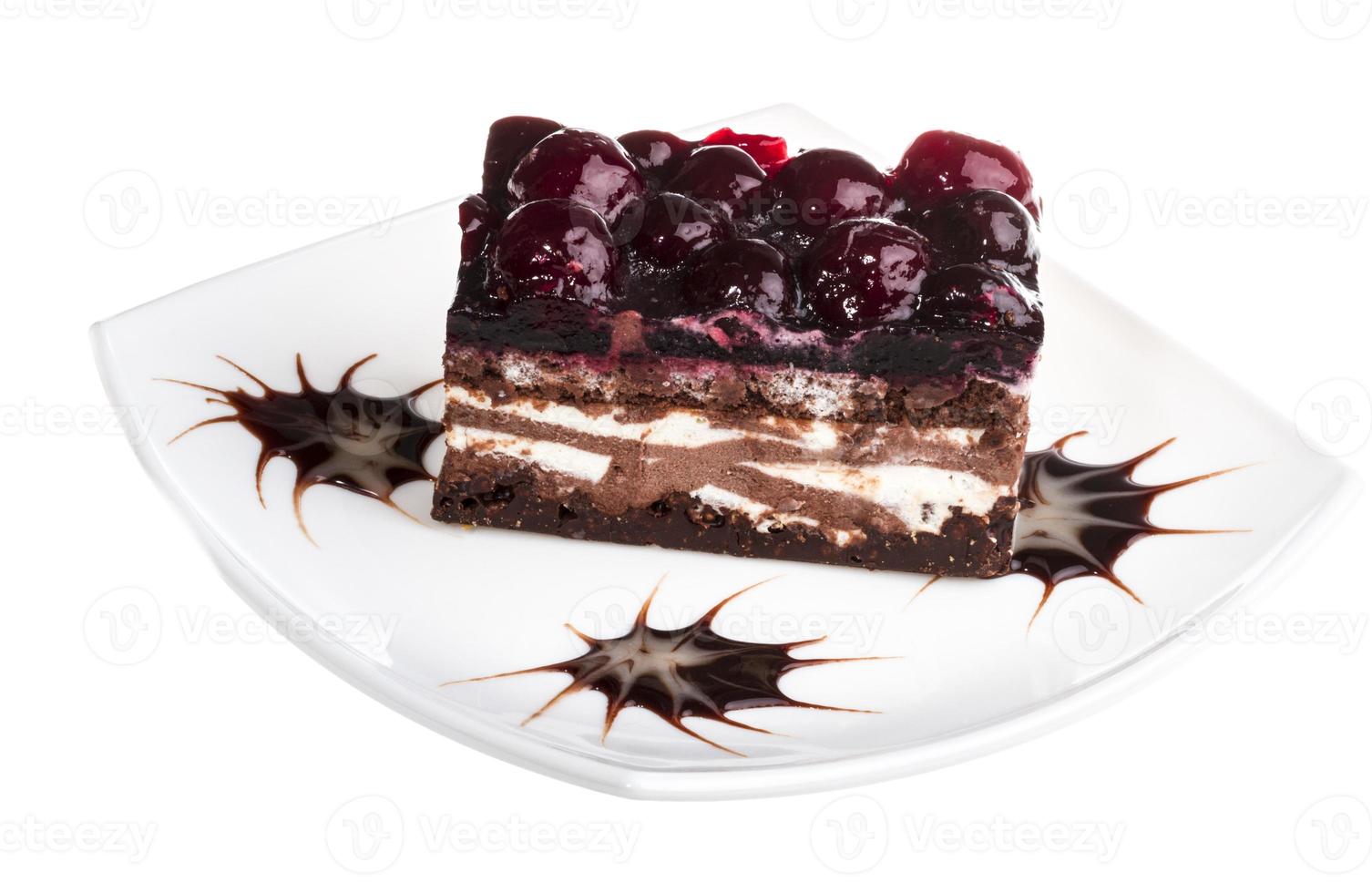 Chocolate cake with cherry on top on a white background photo