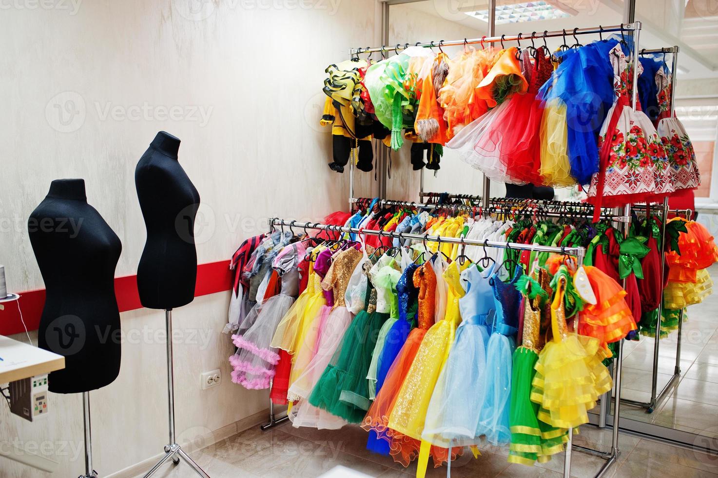 Children's carnival costumes at seamstress office. photo
