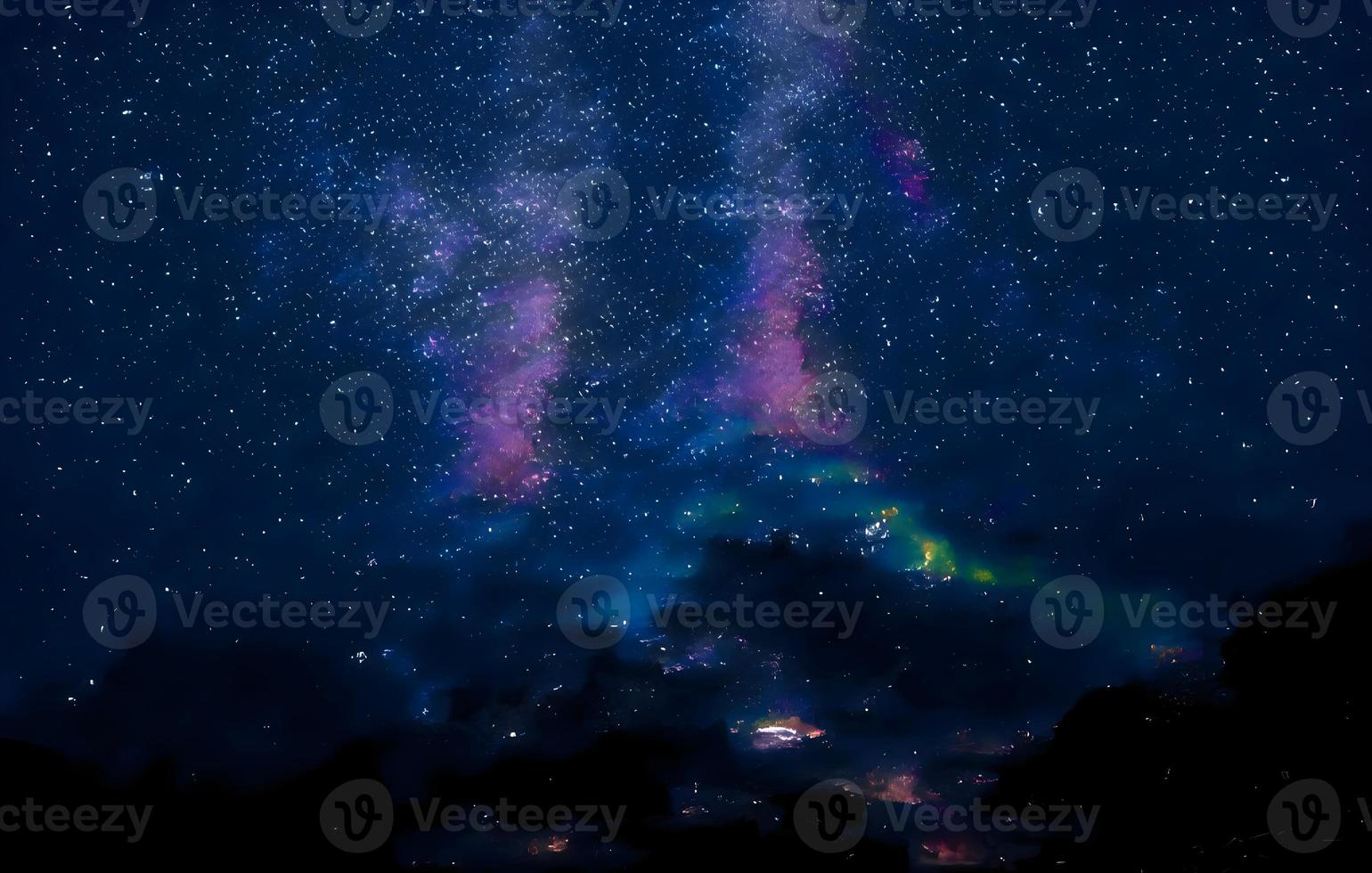 Milky Way and pink light at mountains. Night colorful landscape. Starry sky with hills at summer. Beautiful Universe. Space background with galaxy. Travel background photo