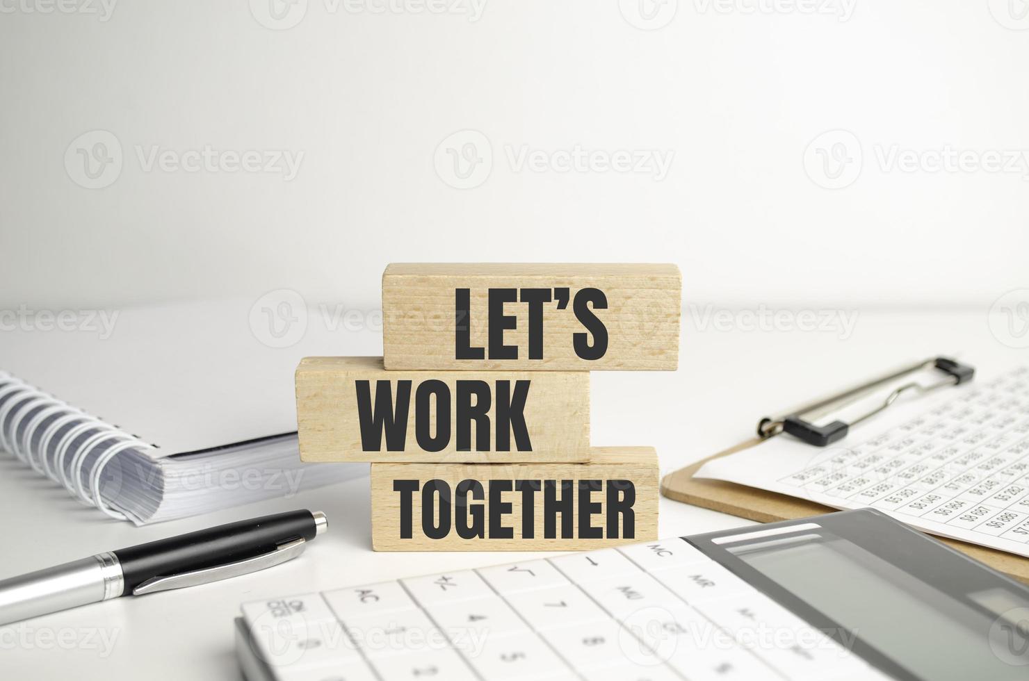 Alphabet letter block in word let's work together white background photo