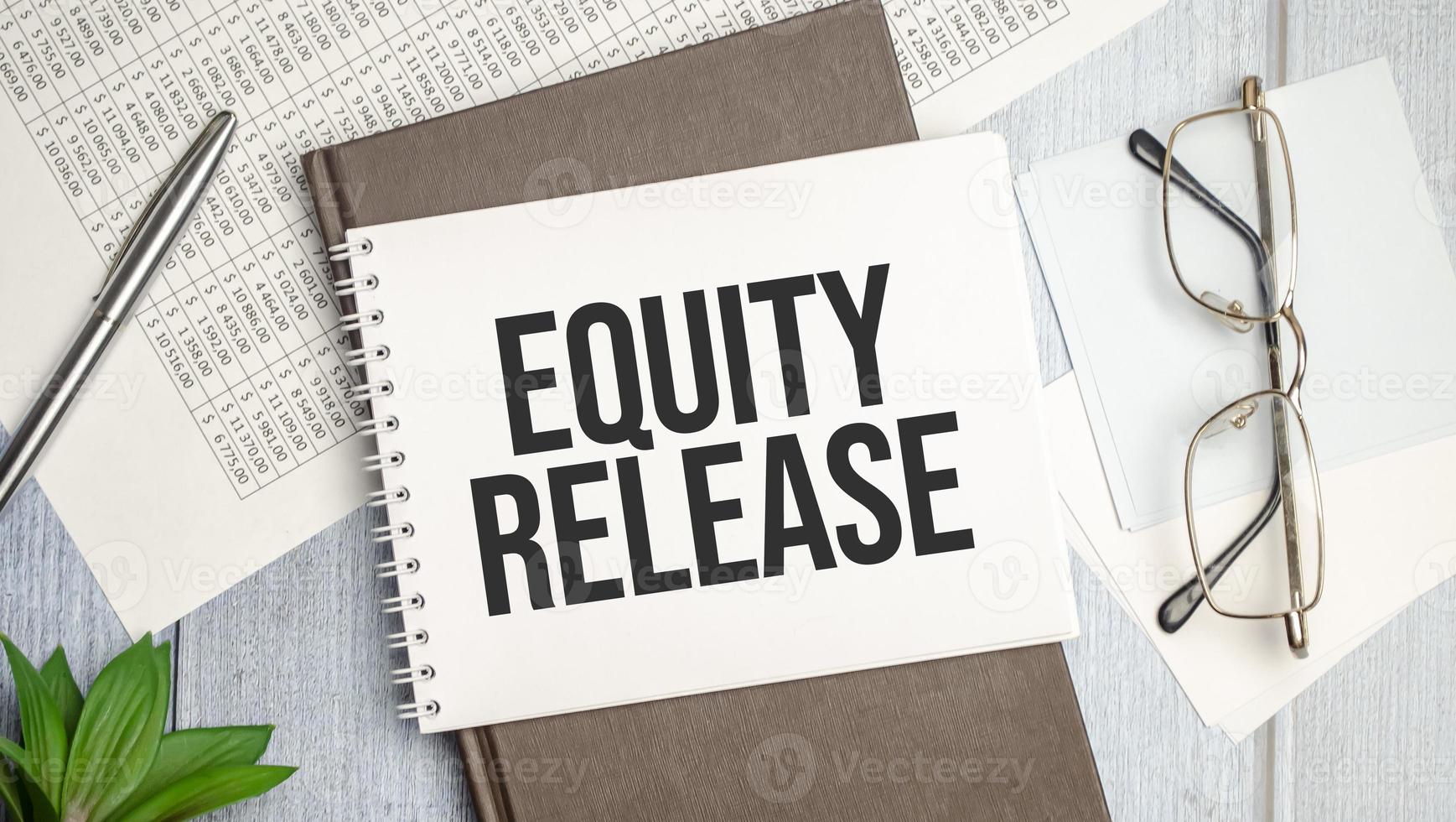 Equity Release text on the paper with pen photo