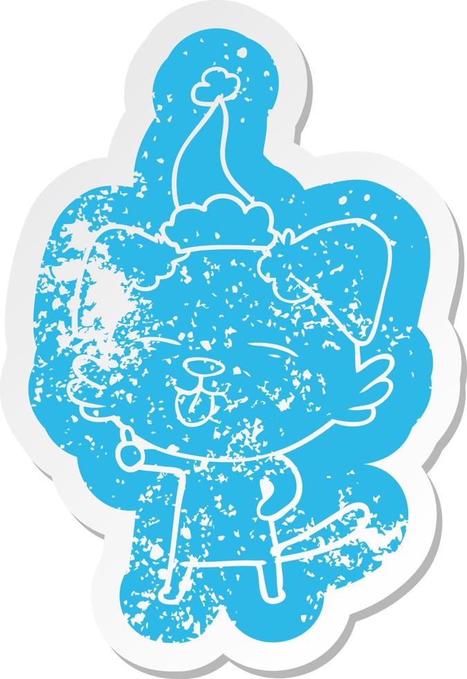 cartoon distressed sticker of a dog sticking out tongue wearing santa hat vector