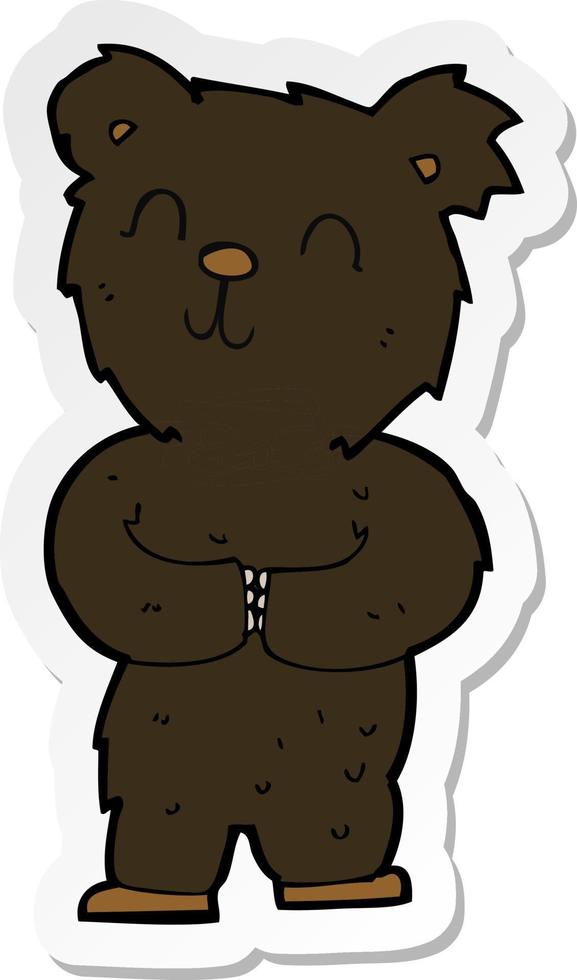 sticker of a cartoon happy little black bear vector