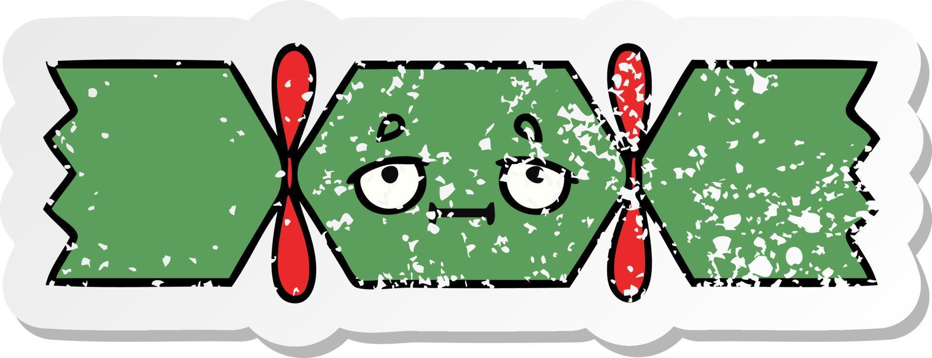 distressed sticker of a cute cartoon christmas cracker vector