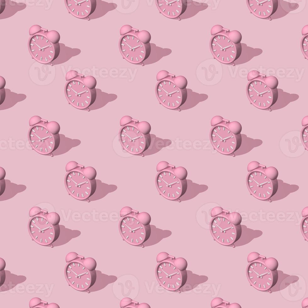 Pink alarm clocks big and small with shadow on pink background. Long shadow from the summer sunshine. Seamless texture pattern. 3D illustration. photo