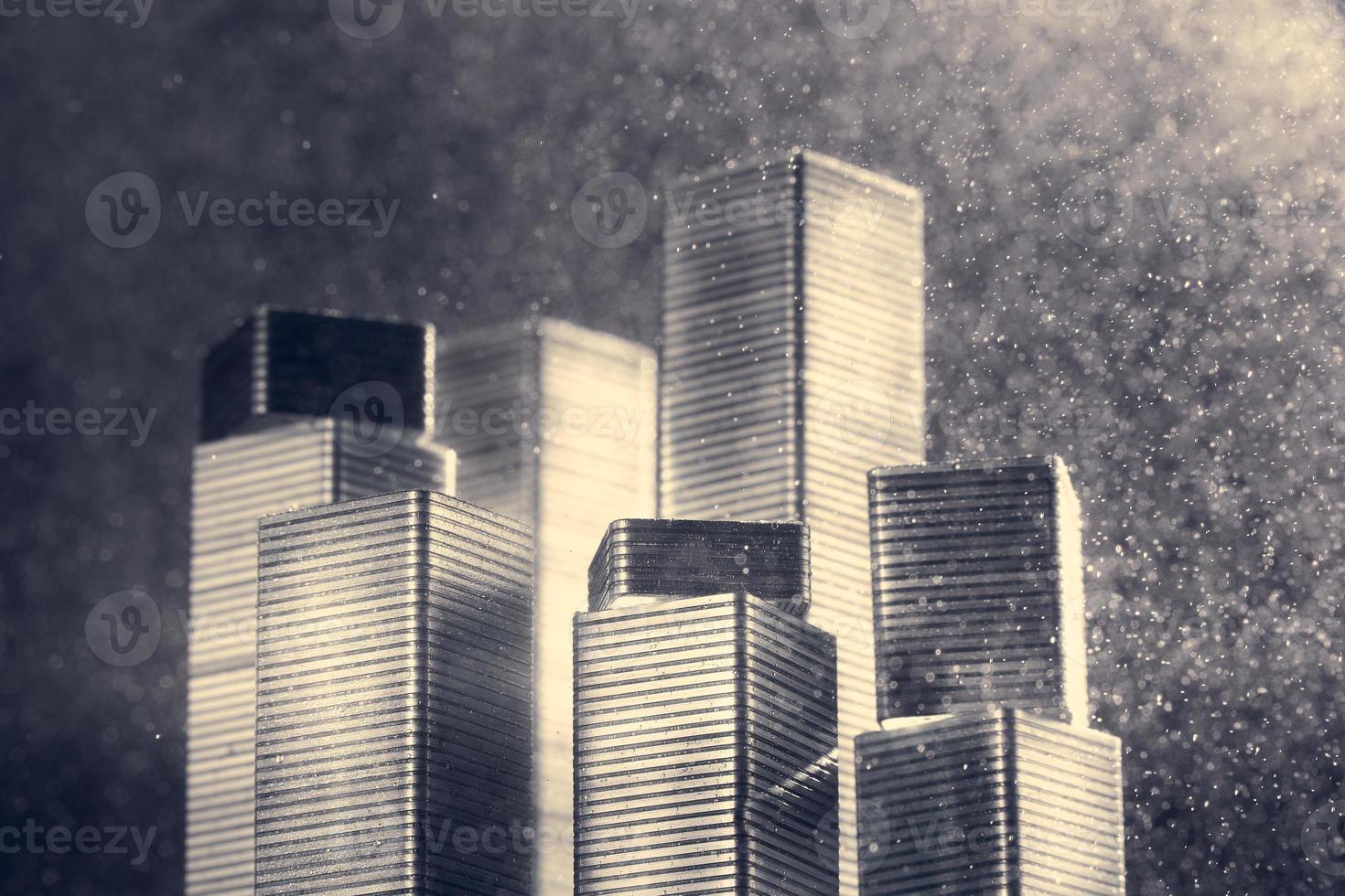 Skyscrapers made of stapler staples illuminated with bright light on a