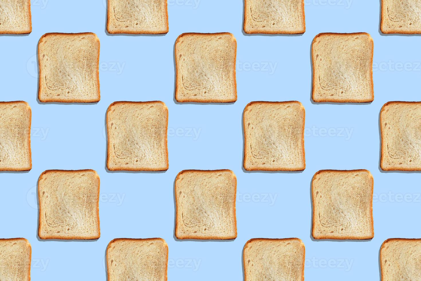 Seamless pattern with crispbread on blue background. photo