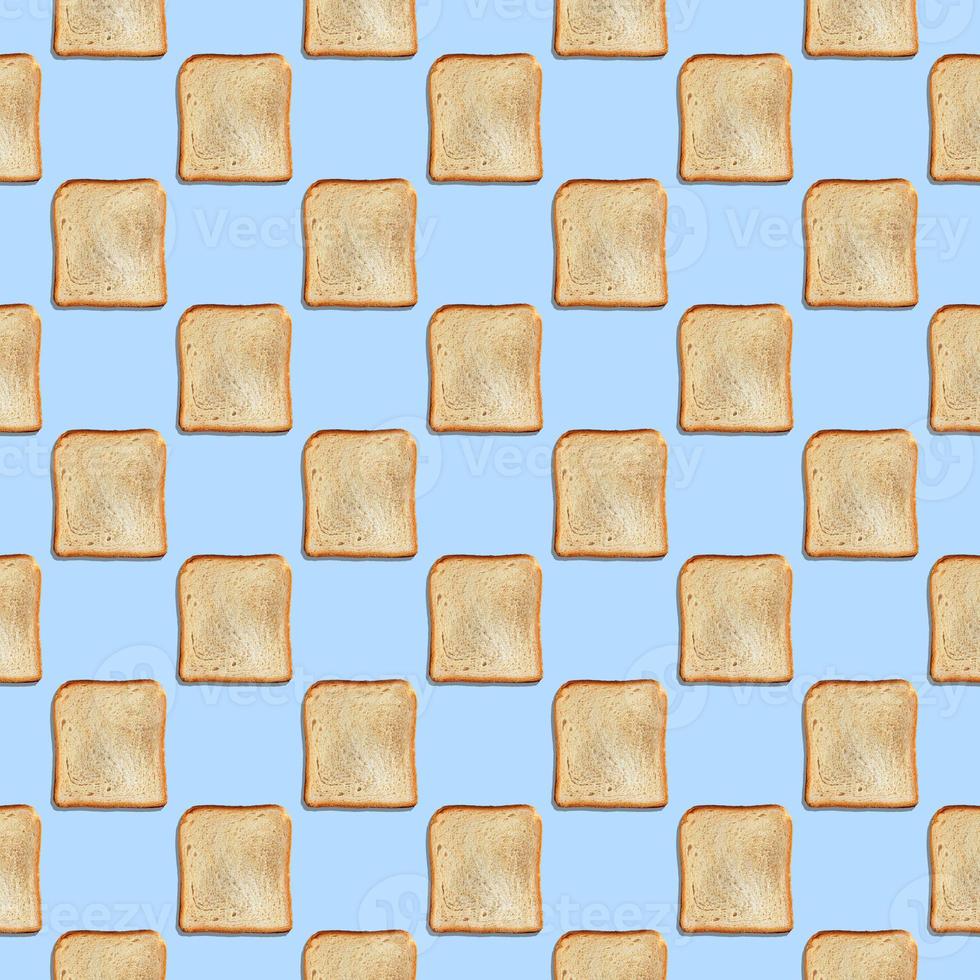 Seamless pattern with crispbread on blue background. photo