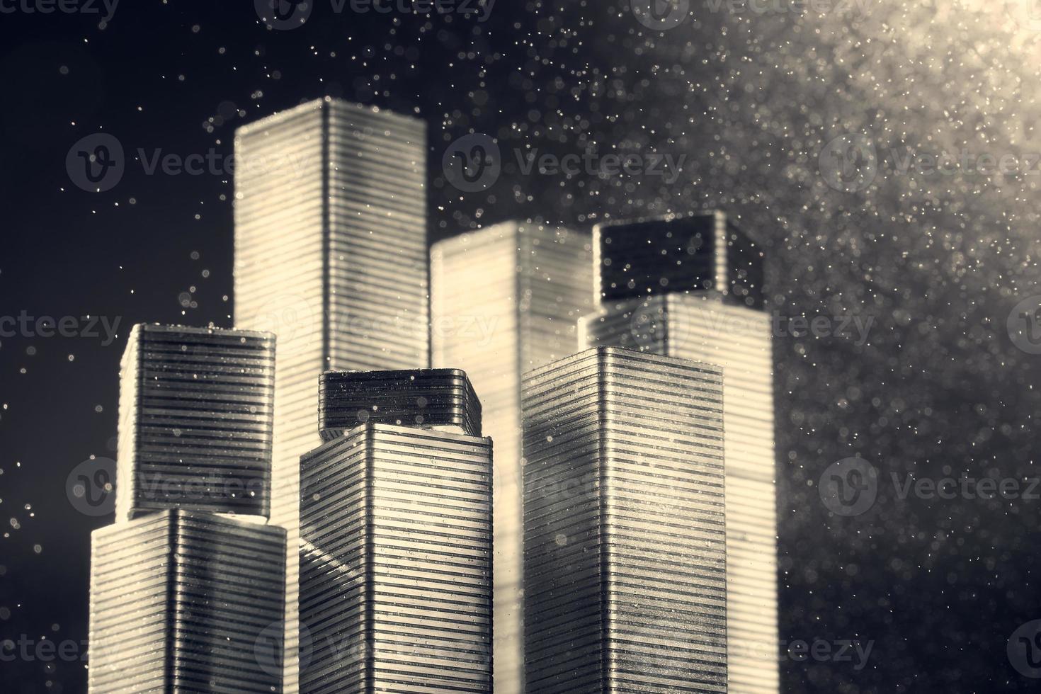 Cityscape made of staples on black background with bokeh. Background in blur. photo