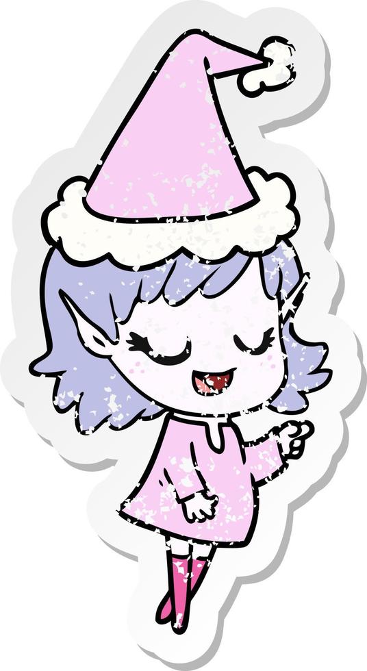 happy distressed sticker cartoon of a elf girl pointing wearing santa hat vector