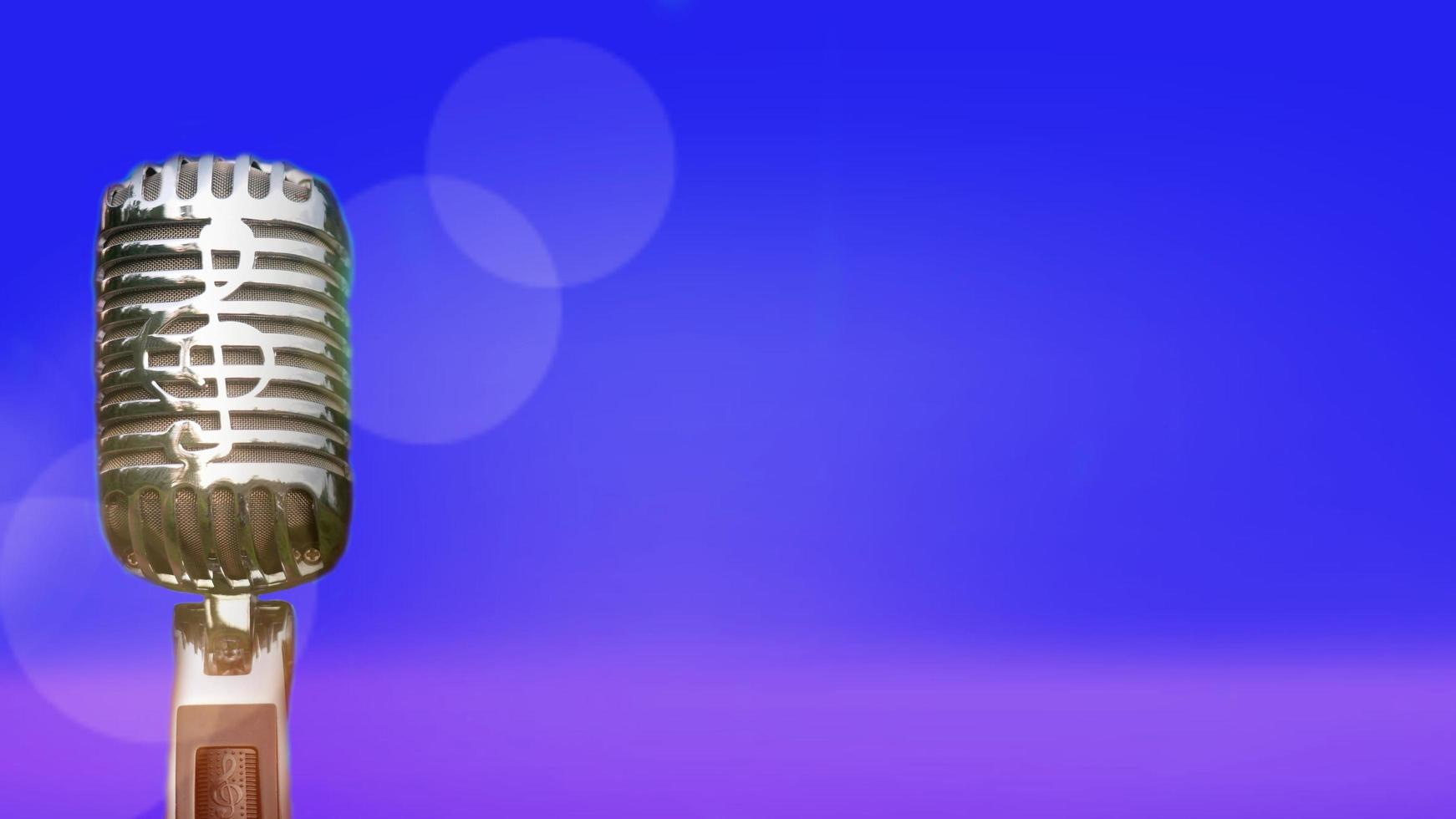 Retro microphone for recording and performing for singers on stage. Bokeh light background can put advertising text. photo