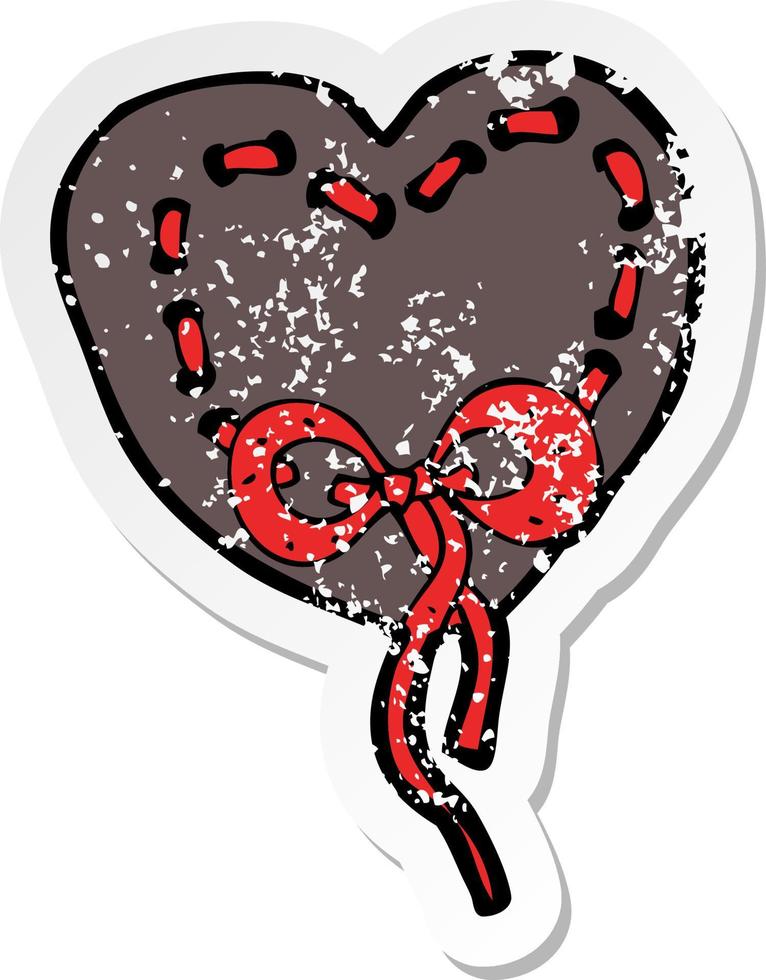 retro distressed sticker of a stitched heart cartoon vector