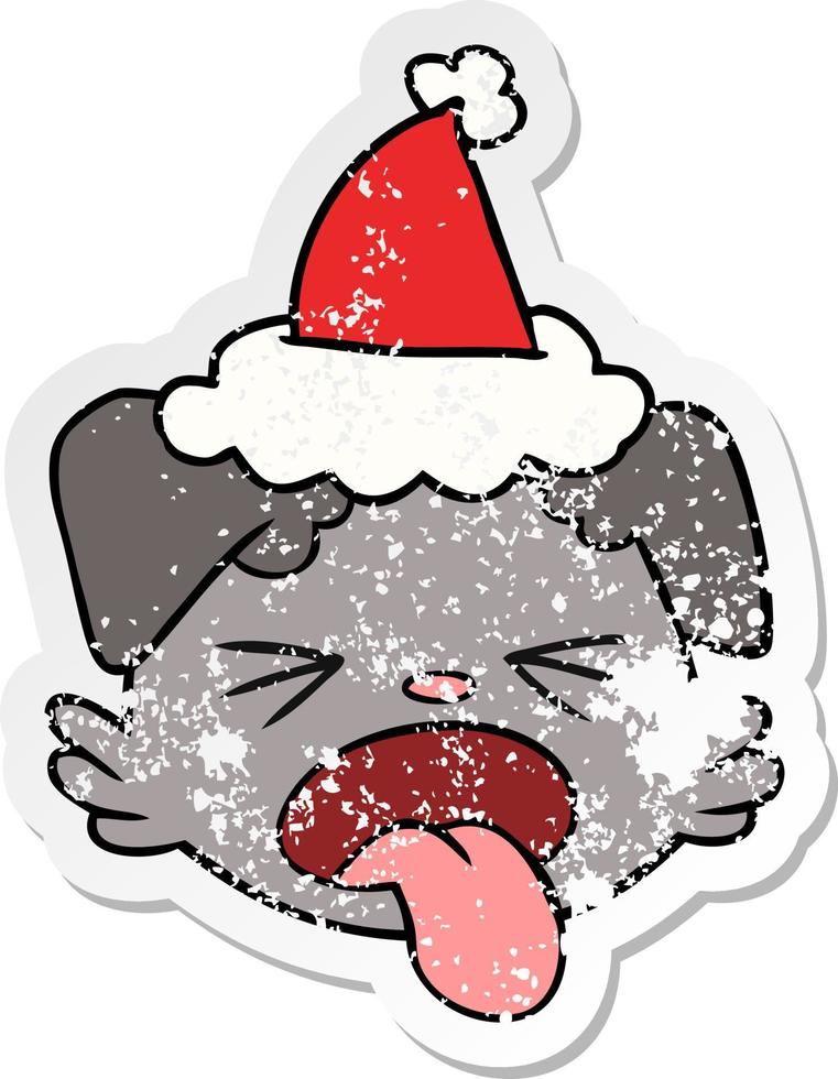 distressed sticker cartoon of a dog face wearing santa hat vector