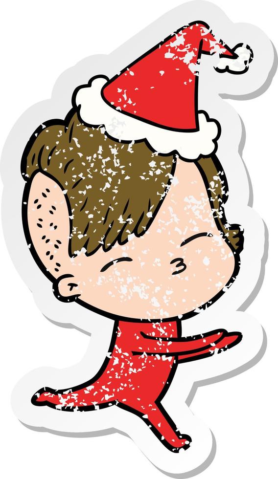 distressed sticker cartoon of a girl in onesie wearing santa hat vector