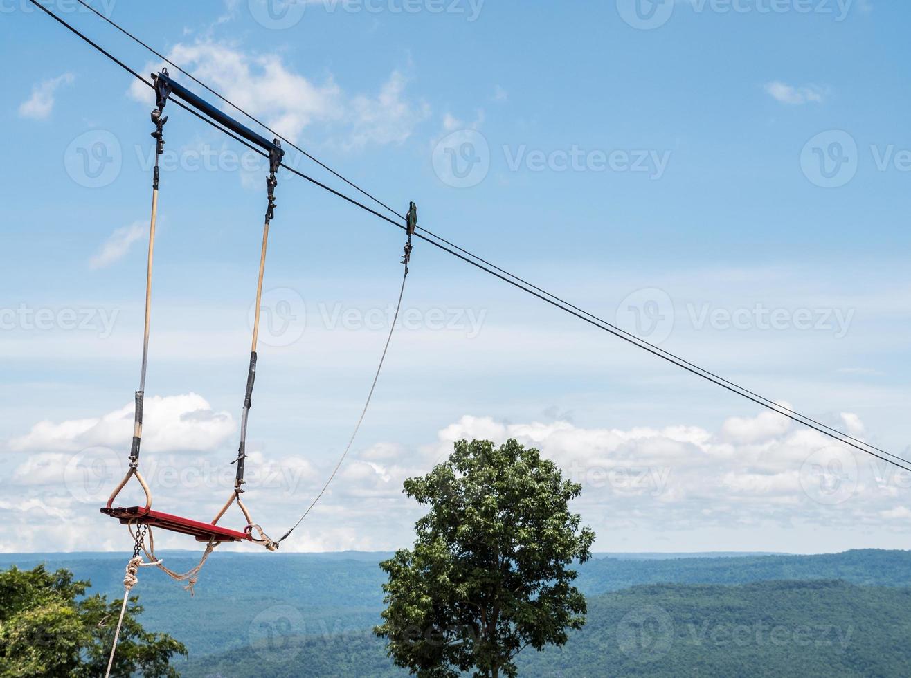 High metal swing is hanging on the sling. photo