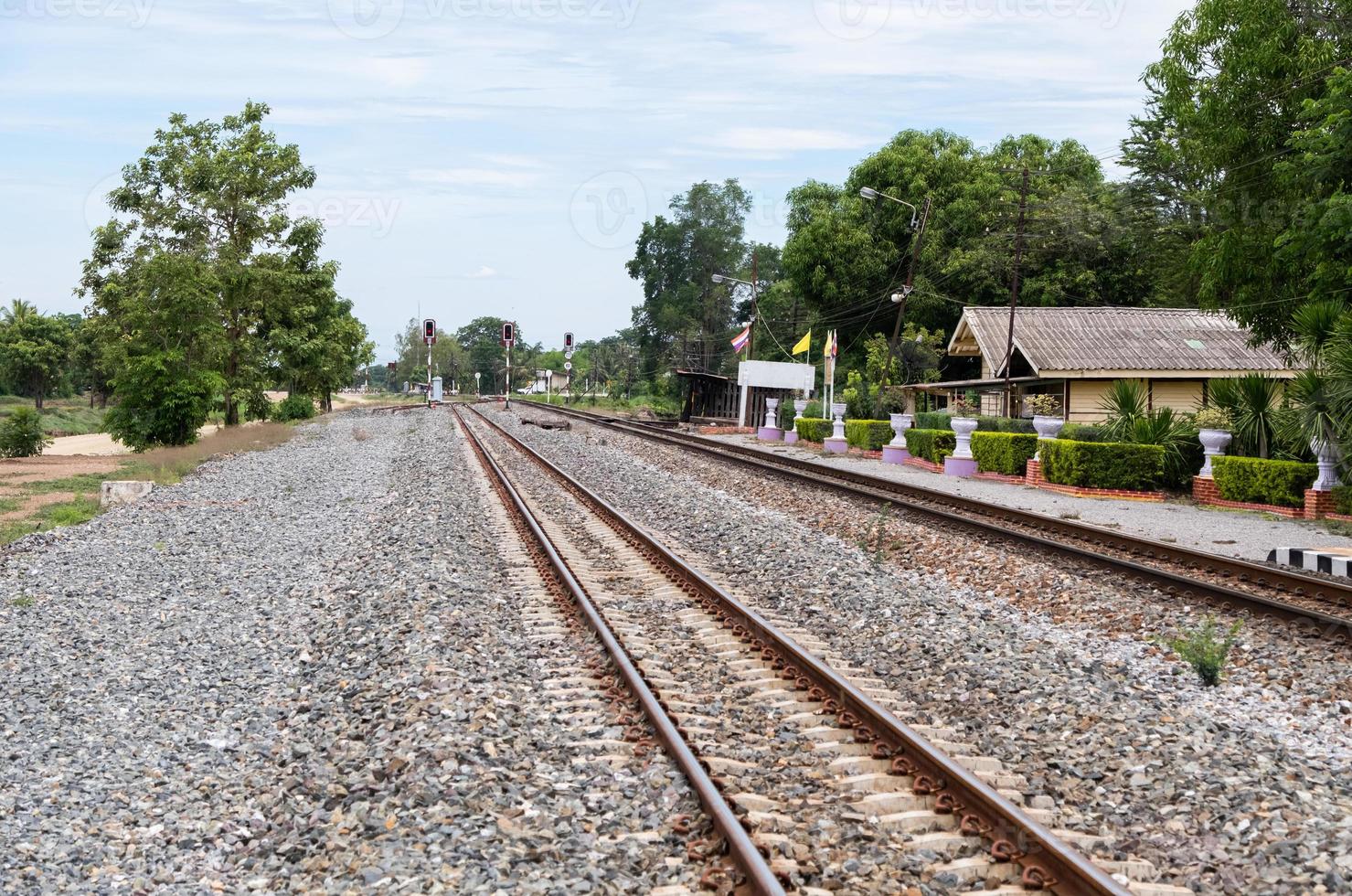 Platform of the rural station with the traffic signal pole. photo