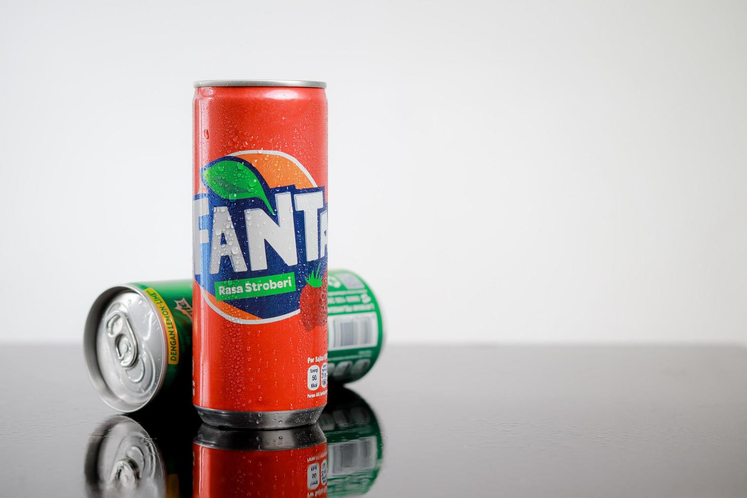Isolated carbonated soft drink by fanta for advertisement. photo