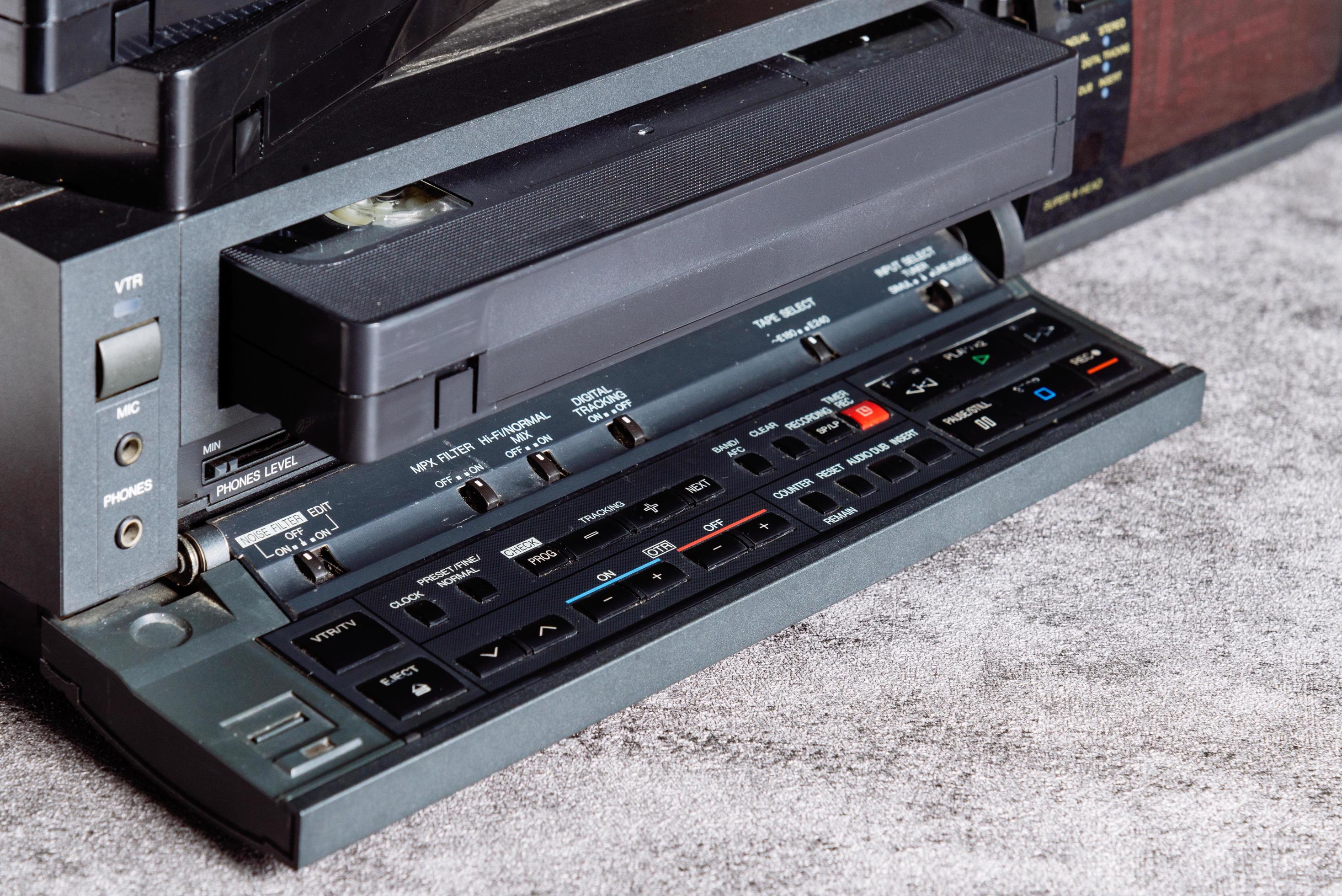 VHS tape in VCR player. 10553058 Stock Photo at Vecteezy