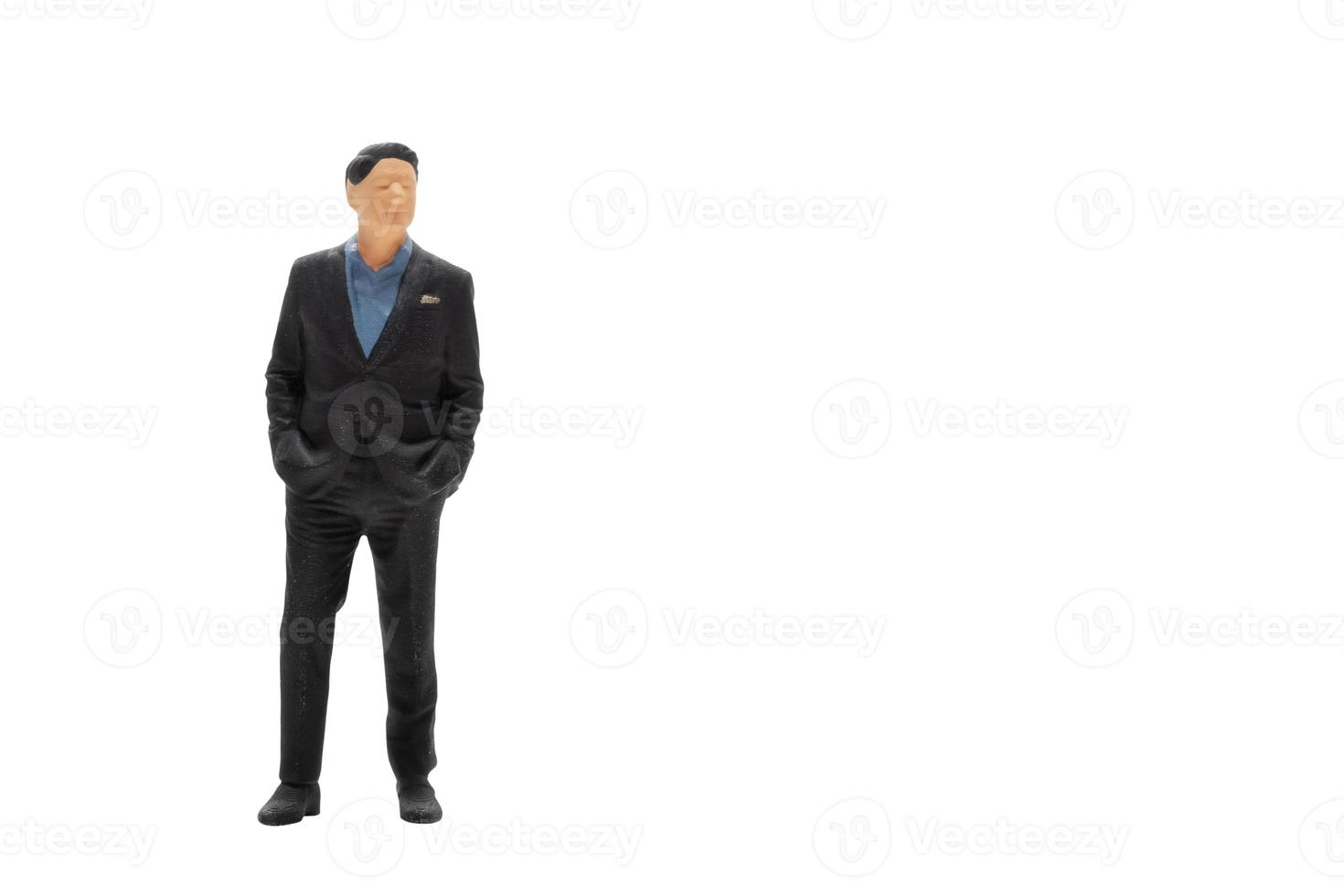 Miniature people businessman wearing black suit with clipping path photo