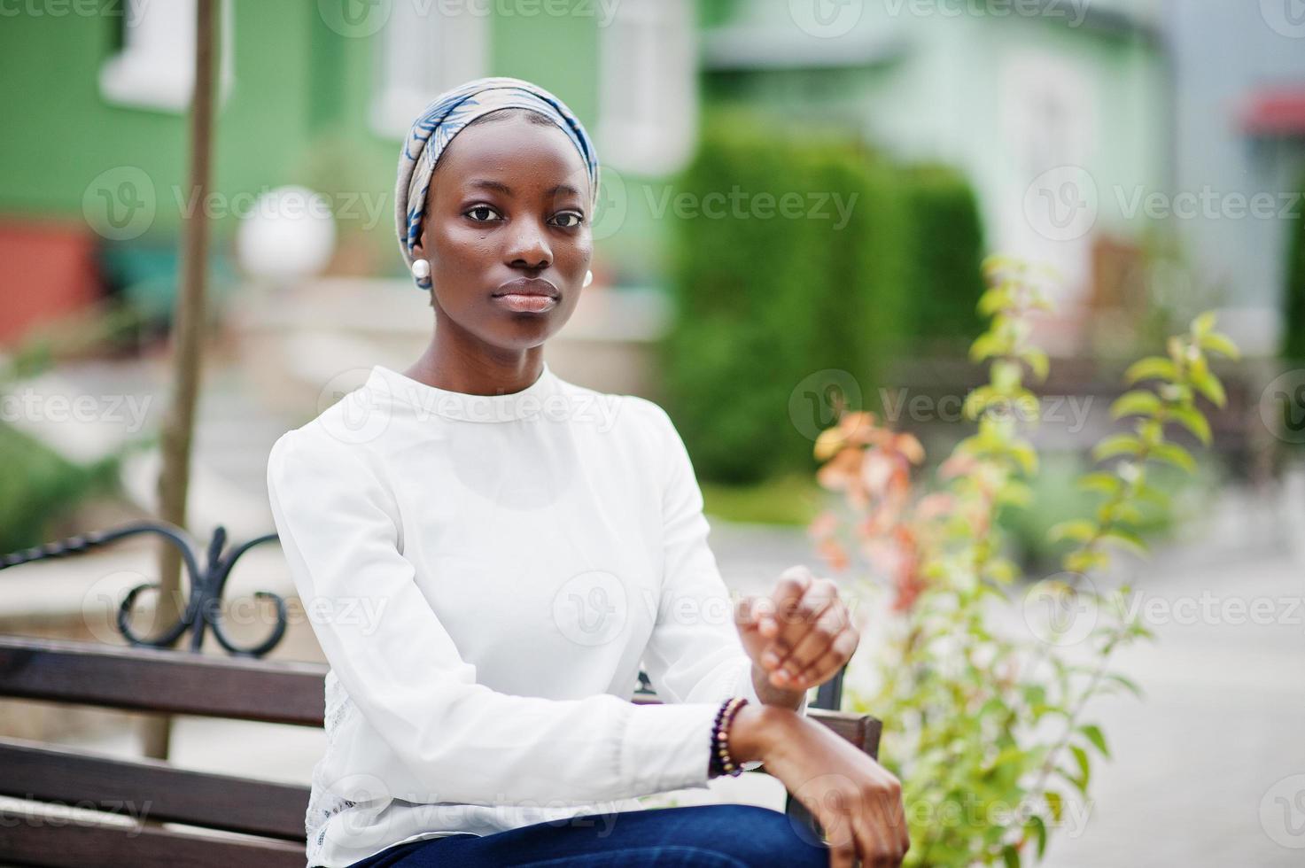 Young modern fashionable, attractive, tall and slim african muslim woman in hijab or turban head scarf posed. photo