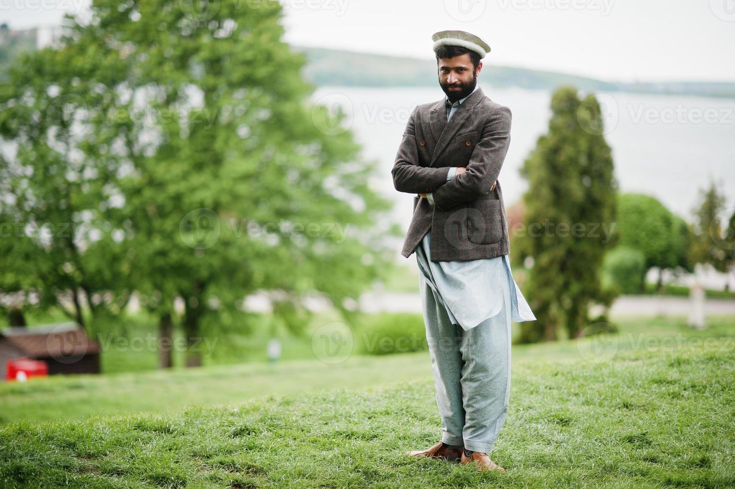 Beard afghanistan man wear pakol hat and jacket. photo