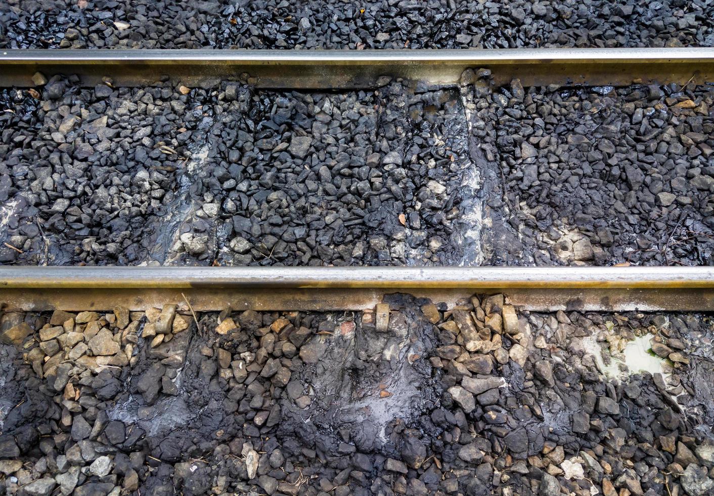 Grease stains running on the sleeper of the railway. 10557865 Stock