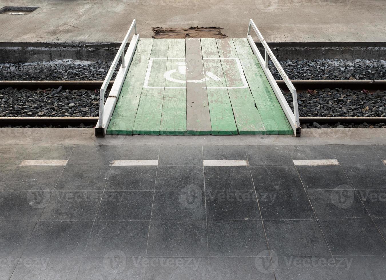 Wooden bridge is cross the railway. photo