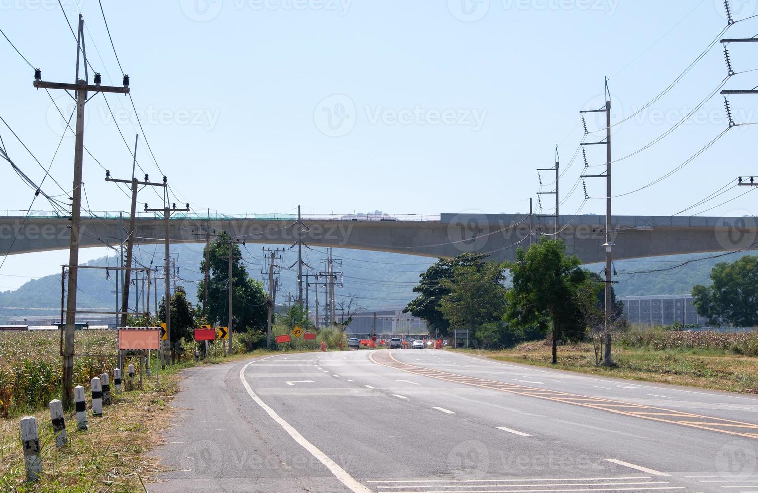 The elevated railway bridge of the double-track project is under construction above the old railway crossing. photo