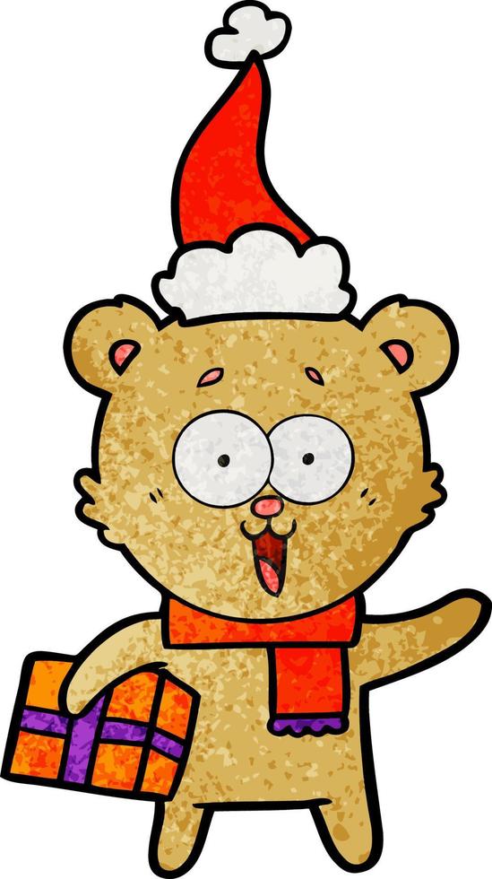 laughing teddy  bear with christmas present wearing santa hat vector