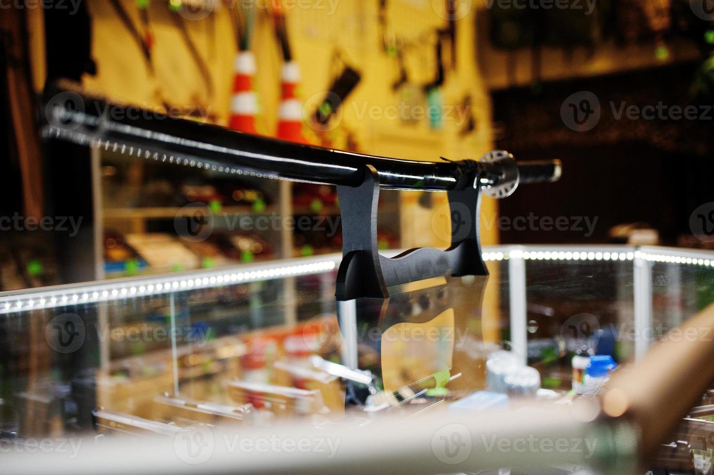 Samurai sword on shelves store weapons on shop center. photo