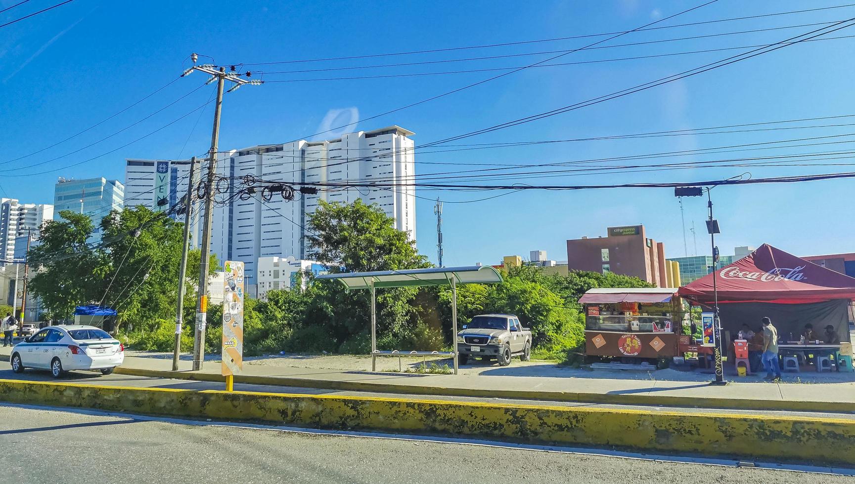 Cancun Quintana Roo Mexico 2022 Typical street road cars buildings and cityscape of Cancun Mexico. photo