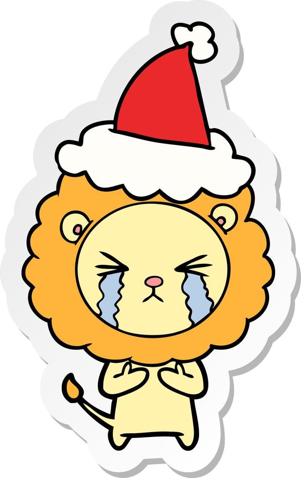 sticker cartoon of a crying lion wearing santa hat vector