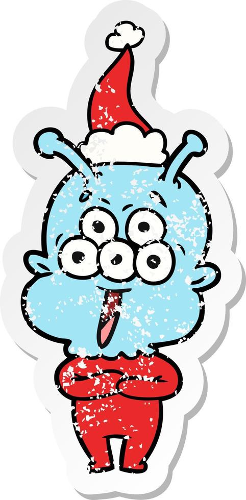 happy distressed sticker cartoon of a alien wearing santa hat vector