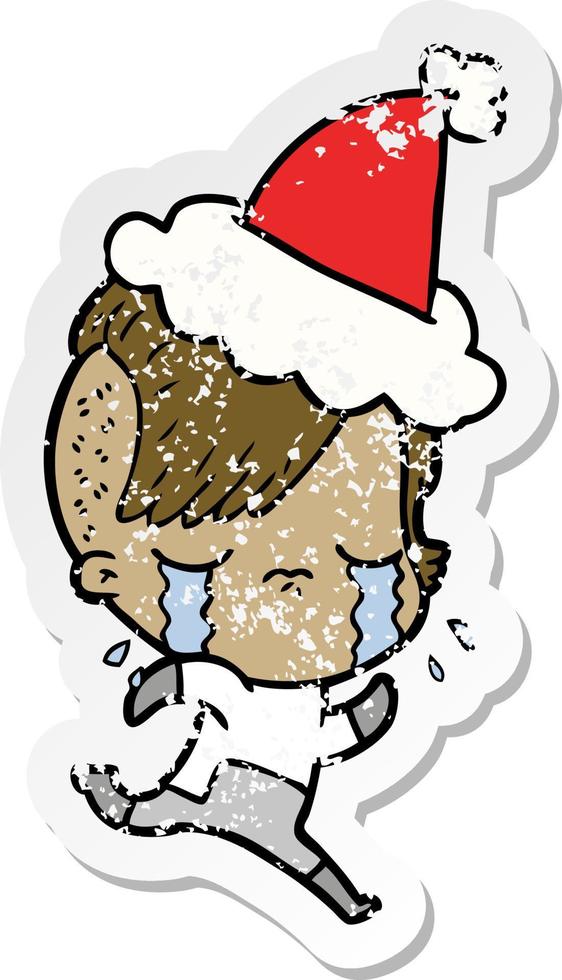 distressed sticker cartoon of a crying girl wearing space clothes wearing santa hat vector