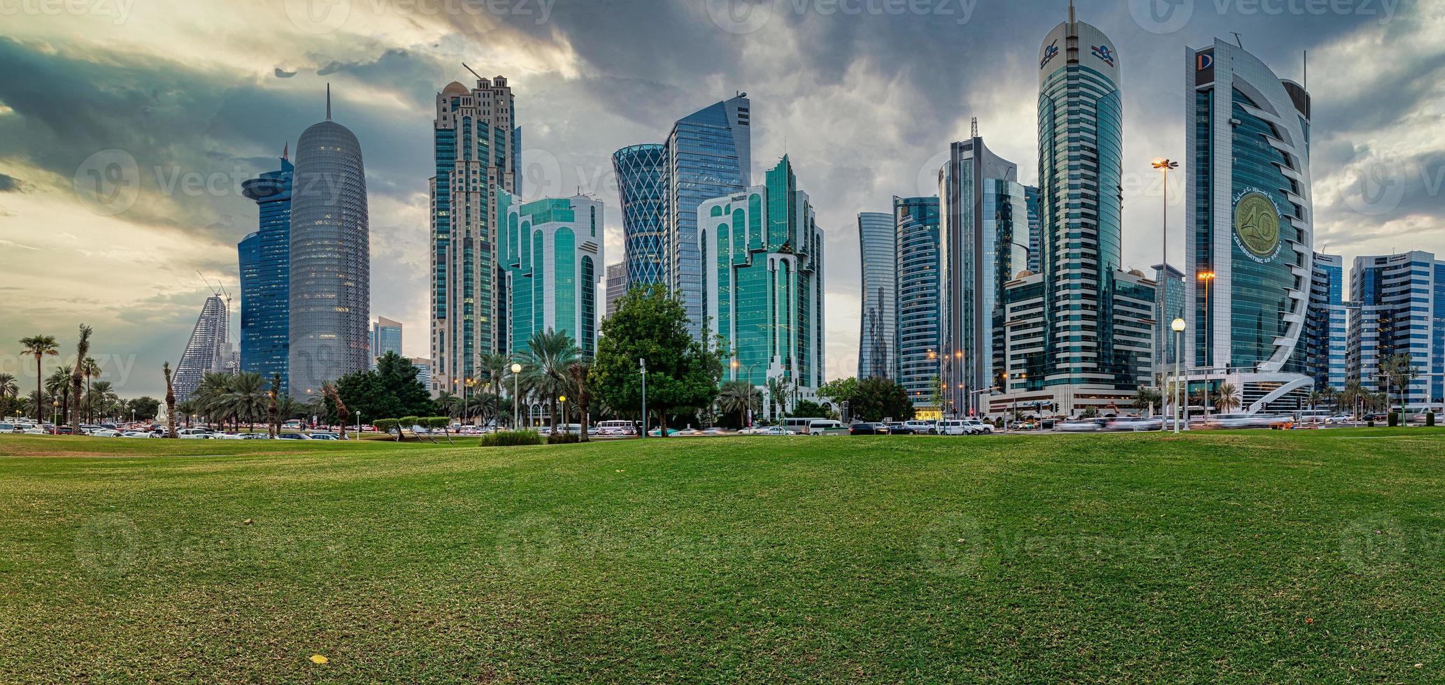 Doha skyline in West bay district daylight view with clouds in the sky photo