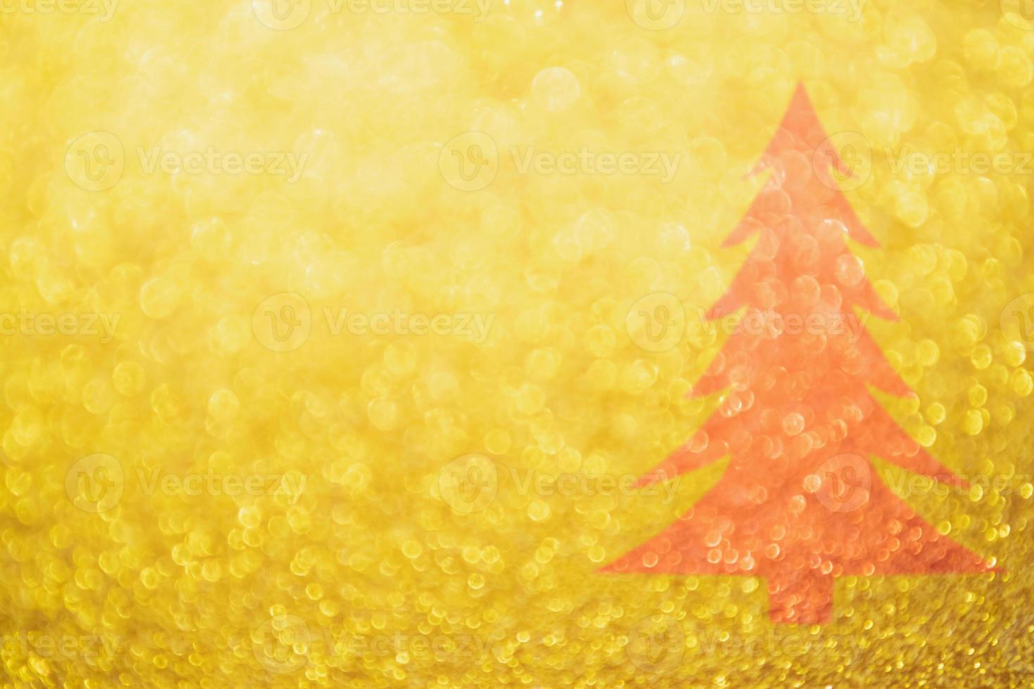 Abstract Gold glitter festive with red Christmas tree texture background blur with bokeh light photo