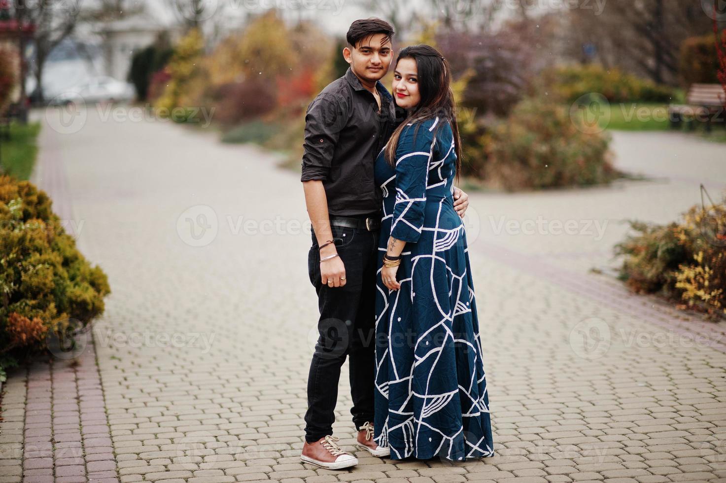 Love story of indian couple posed outdoor. photo