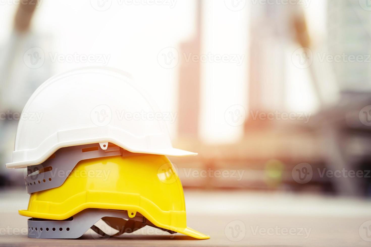 Construction engineers discussion with architects at construction site or building site of highrise building photo