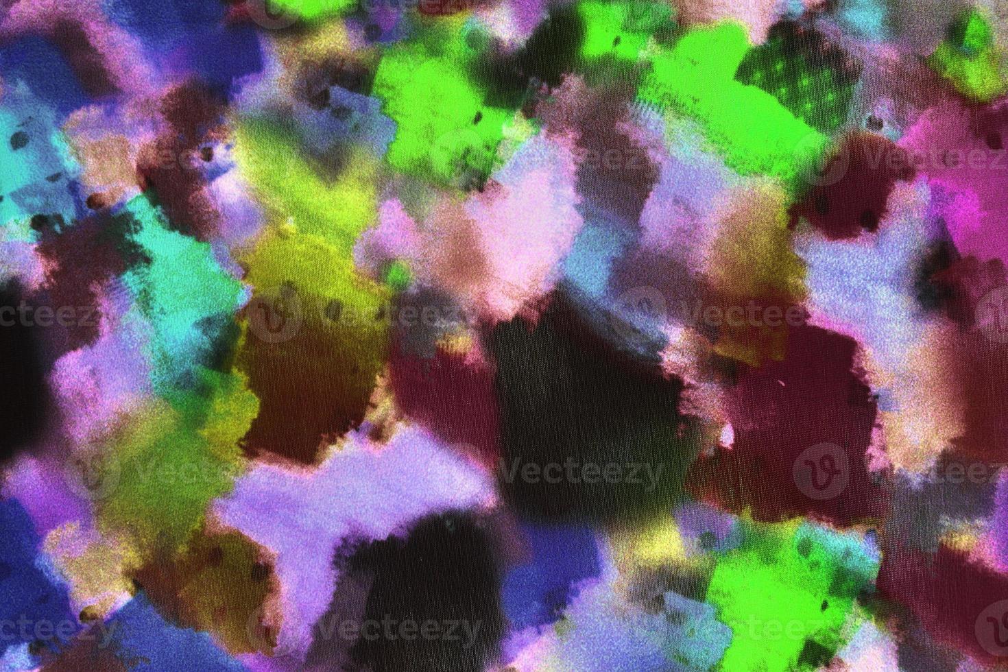 Detailed close up view on samples of cloth and fabrics in different colors found at a fabrics market photo