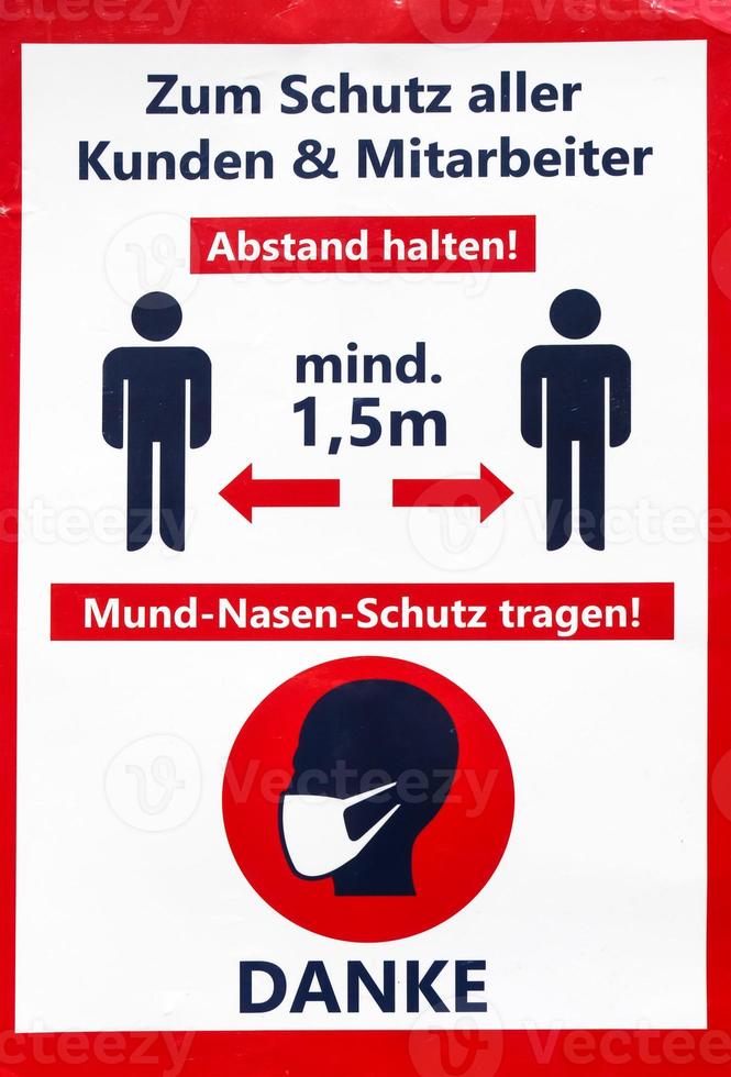 Keep distance symbol in german language 2 meter social distancing sign for COVID 19. photo