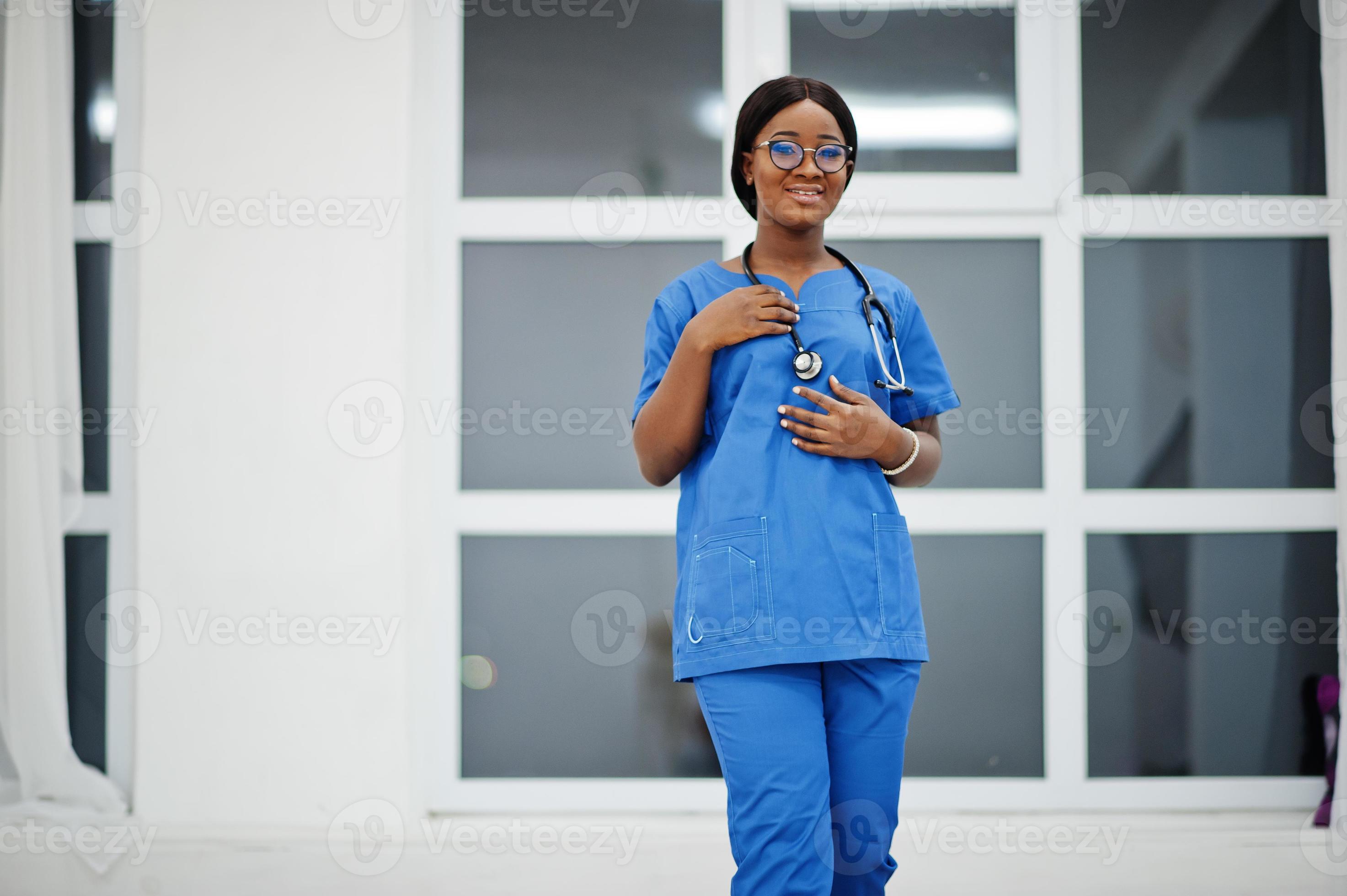 Portrait of happy female african american young doctor pediatrician in blue uniform coat and