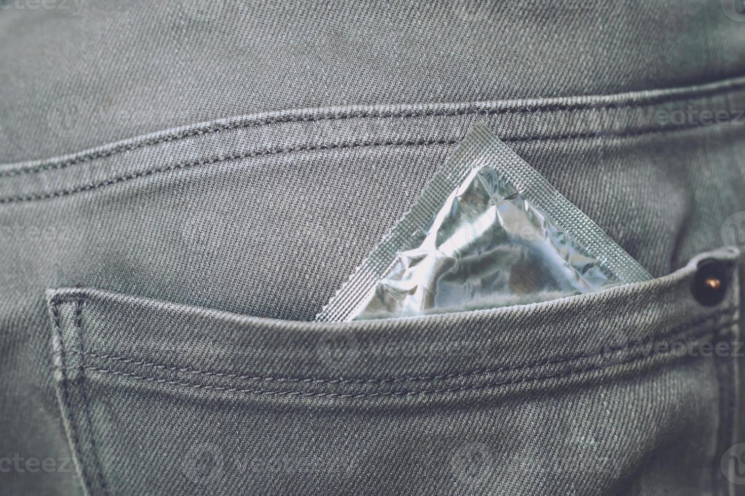 Men are using condoms to prevent AIDS. photo