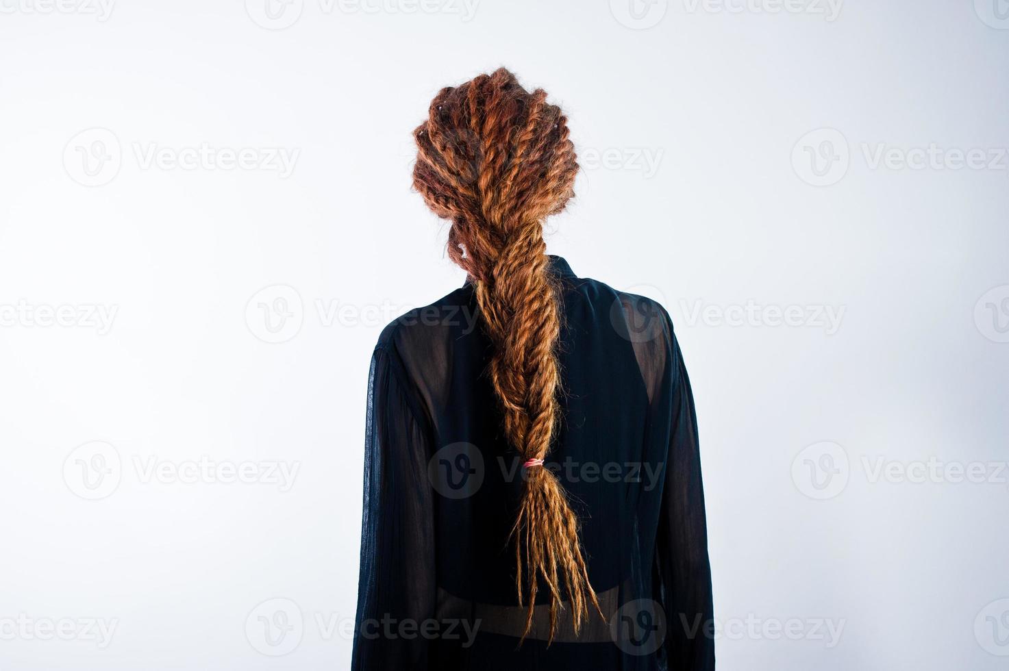 Studio shoot of back girl with dreads on white background. photo