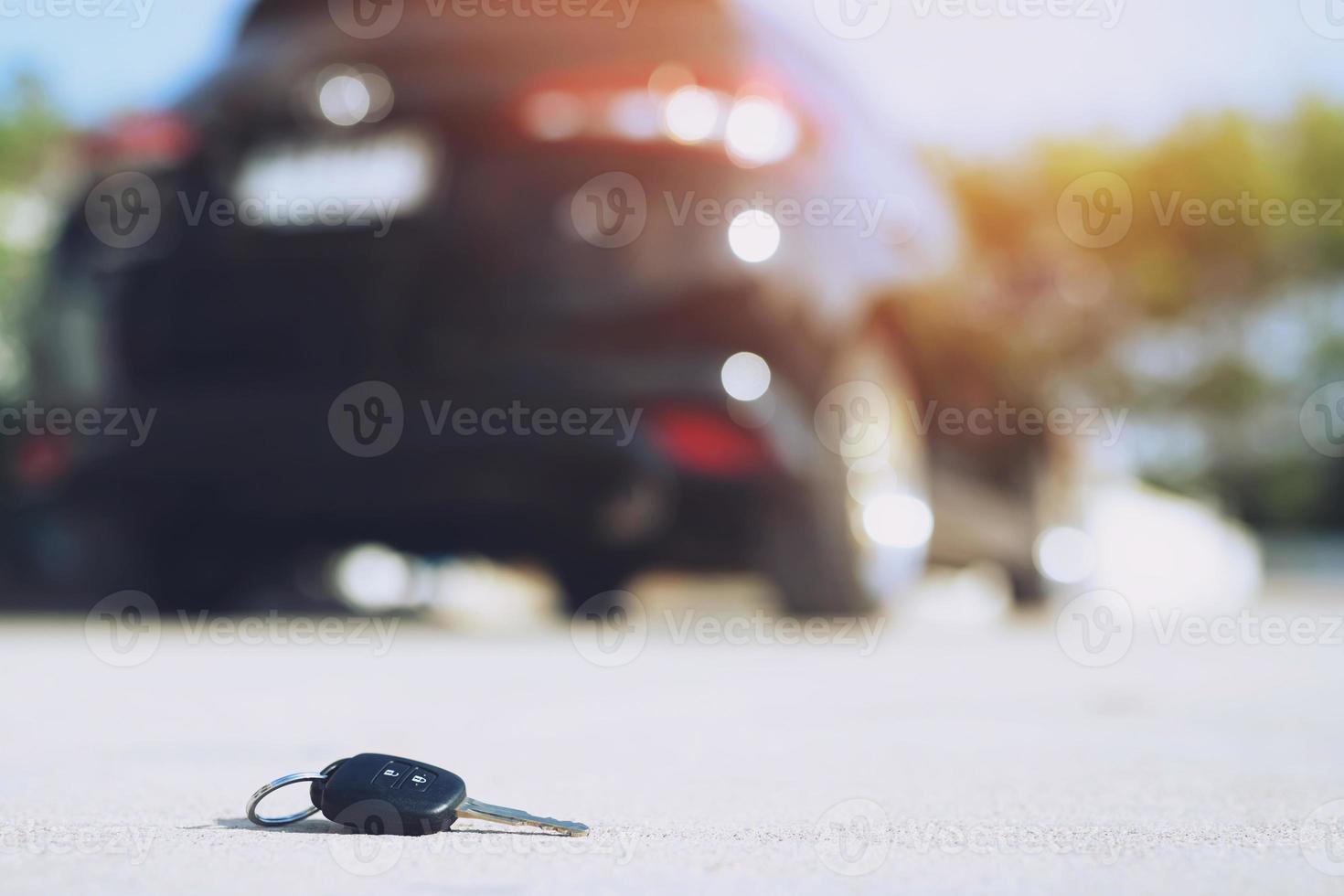 abstract lost car keys fall lying on the street concrete cement ground roadway home front yard. photo