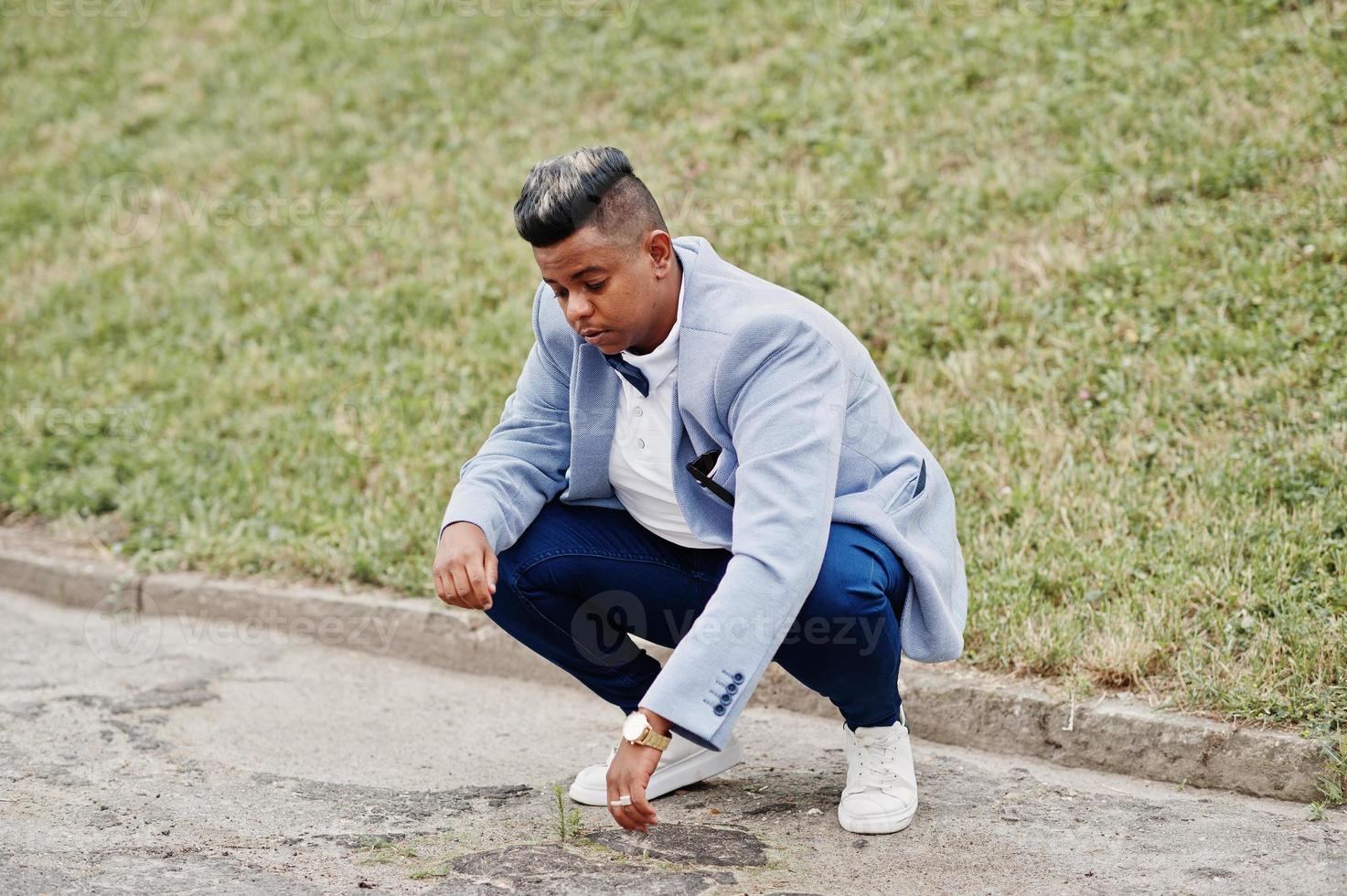 Stylish arabian man in jacket, bow tie posed outdoor. Arab model boy. photo